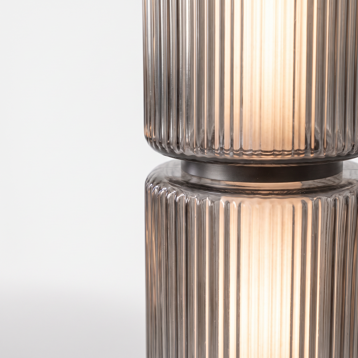 Barbican ribbed glass floor lamp, close-up of the smoky grey ribbed glass sections