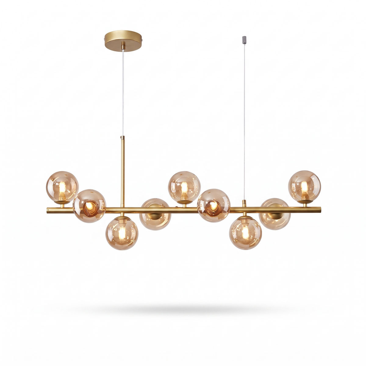 Barnes linear glass globe chandelier, brass bar with cognac glass globes