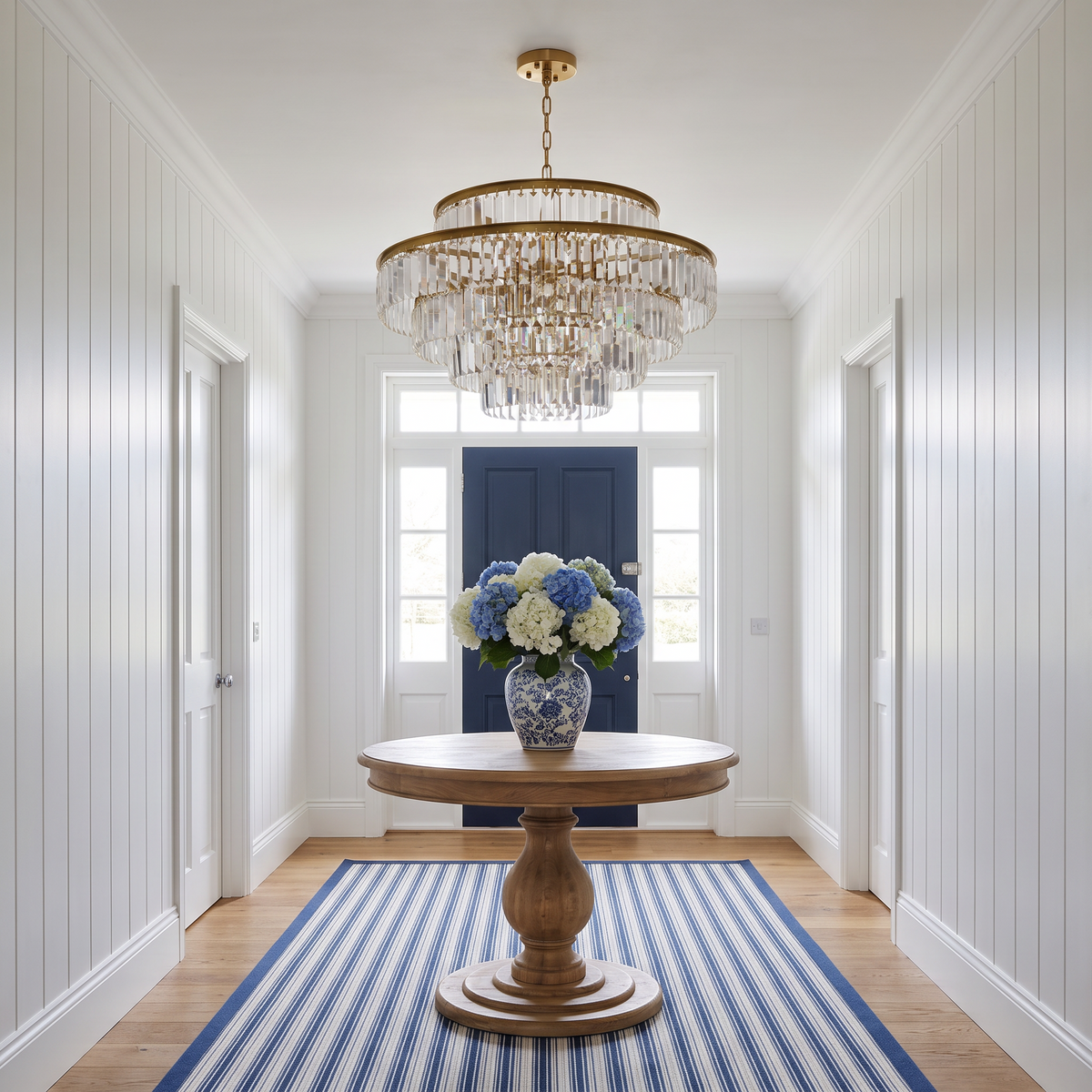 Chelsea tiered crystal chandelier in a white Hamptons-style entrance hall