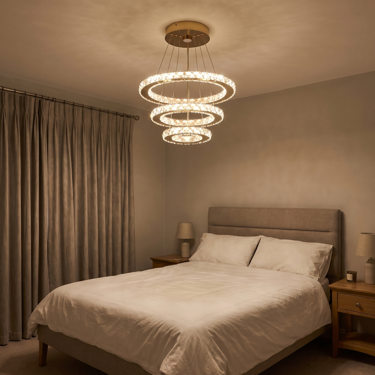 Clarence crystal ring pendant light in gold, lit in a bedroom in the evening
