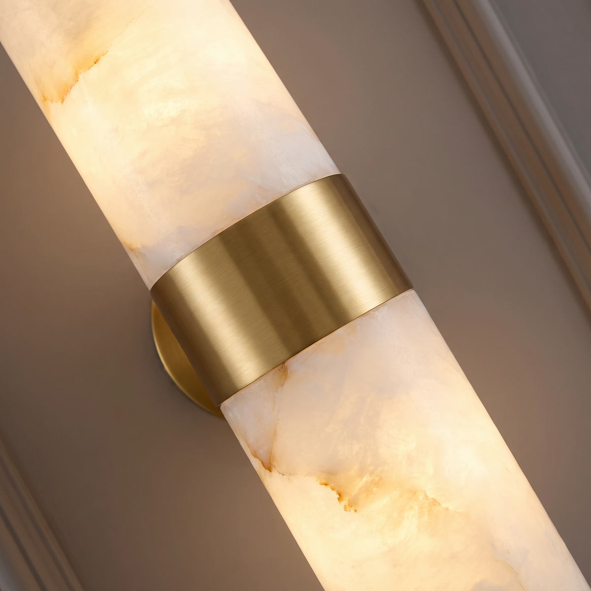 Holland up and down wall light, close-up of the gold ring and alabaster cylinders