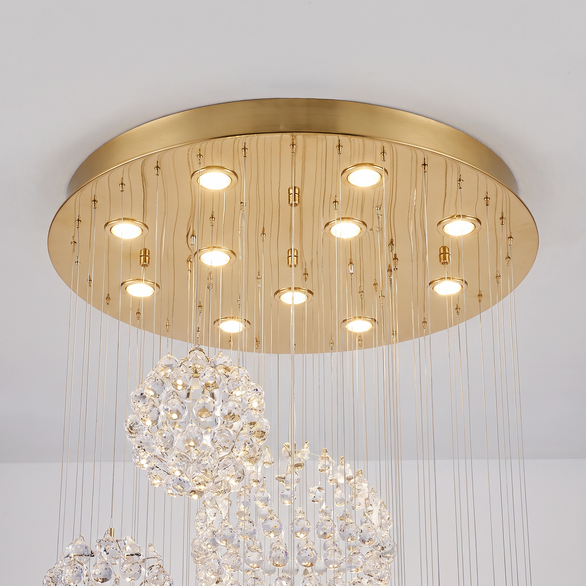 Henley raindrop chandelier, close-up of the gold ceiling canopy with LED spotlights
