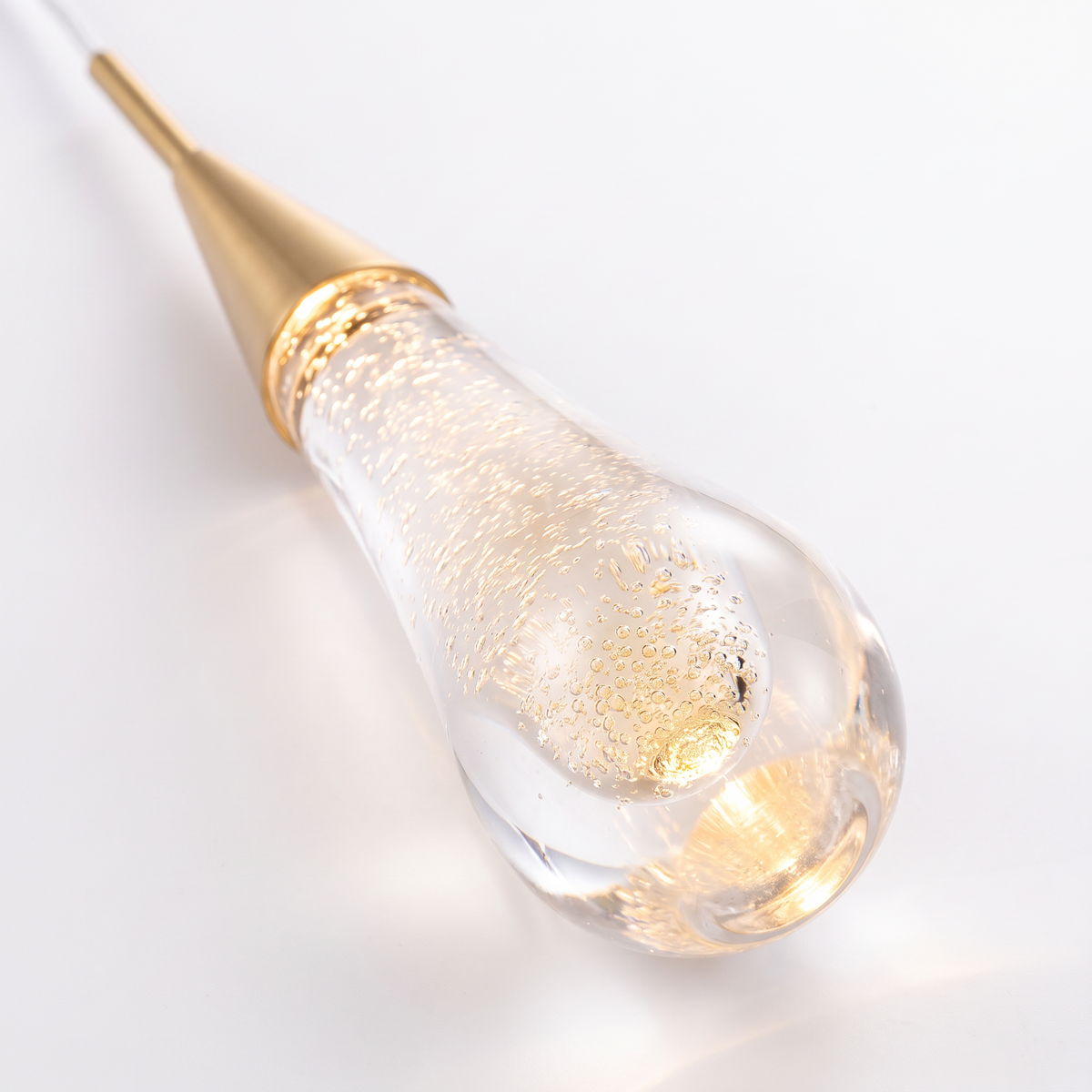 Islington crystal teardrop pendant light, close-up of a lit bubble crystal teardrop