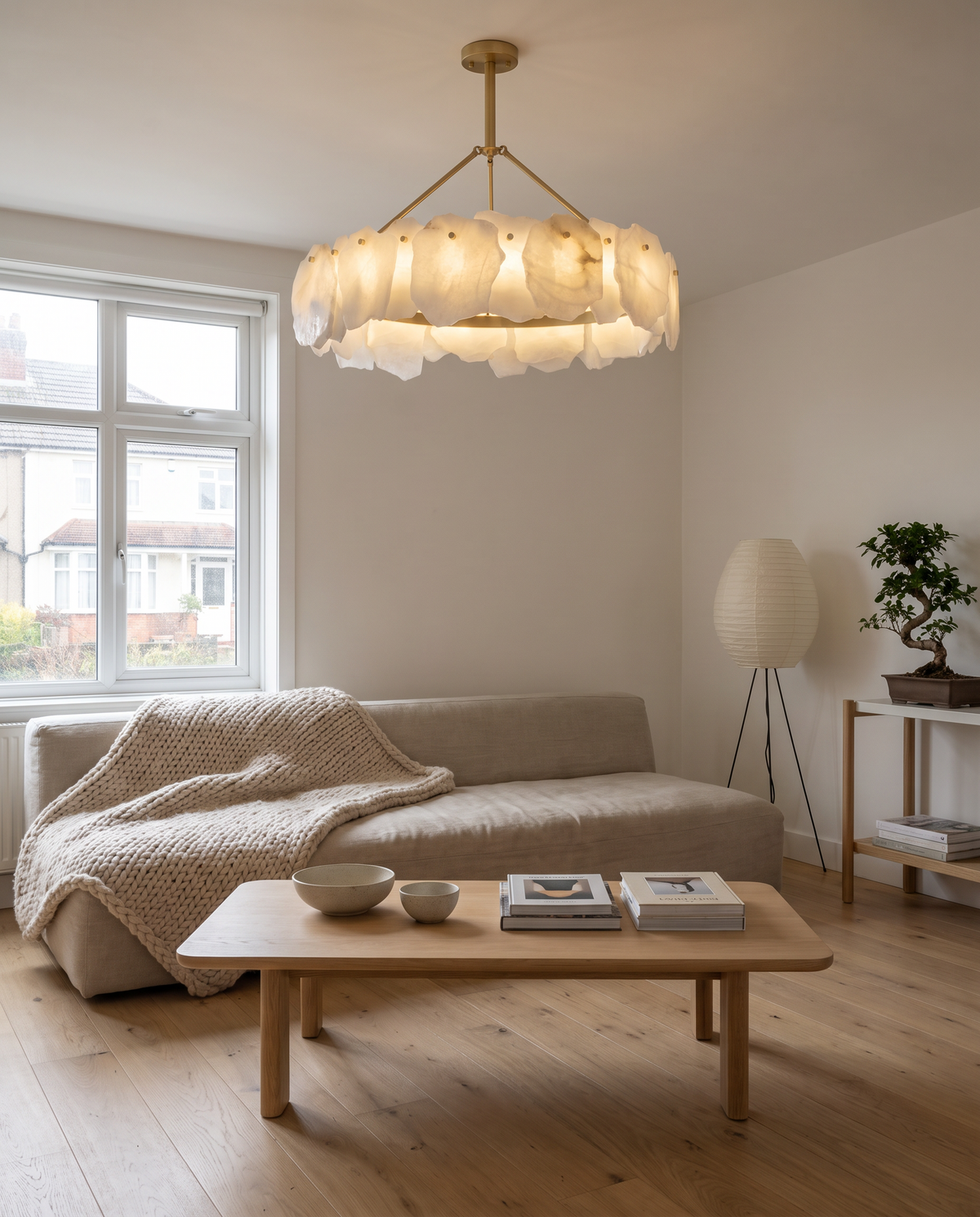 Hurlingham alabaster brass chandelier in a calm Japandi living room with a linen sofa