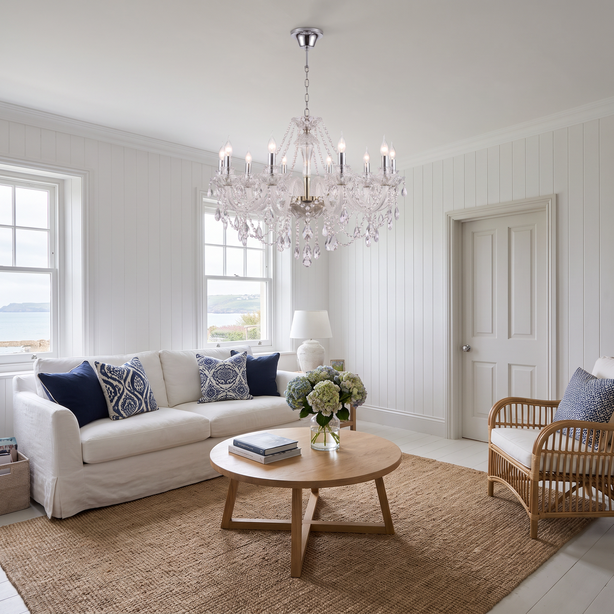 Regent crystal candle chandelier in chrome in a Hamptons-style living room