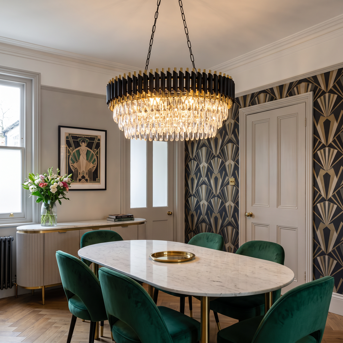 Windsor black and gold crystal chandelier, oval, above a marble dining table in an Art Deco dining room