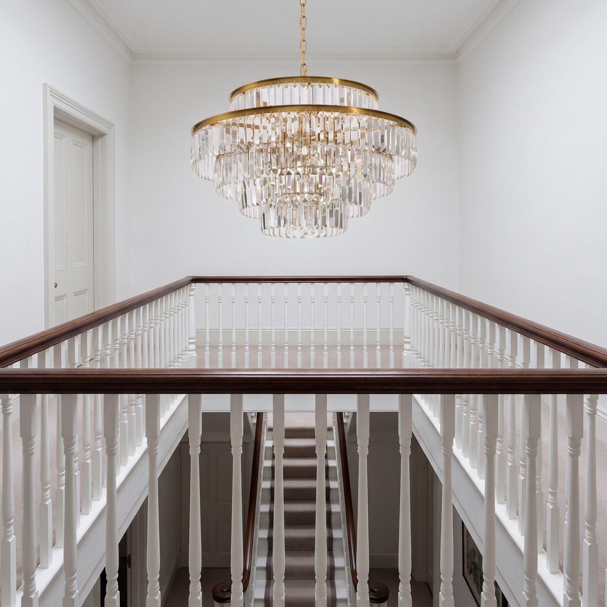 Chelsea tiered crystal chandelier above a Victorian stairwell