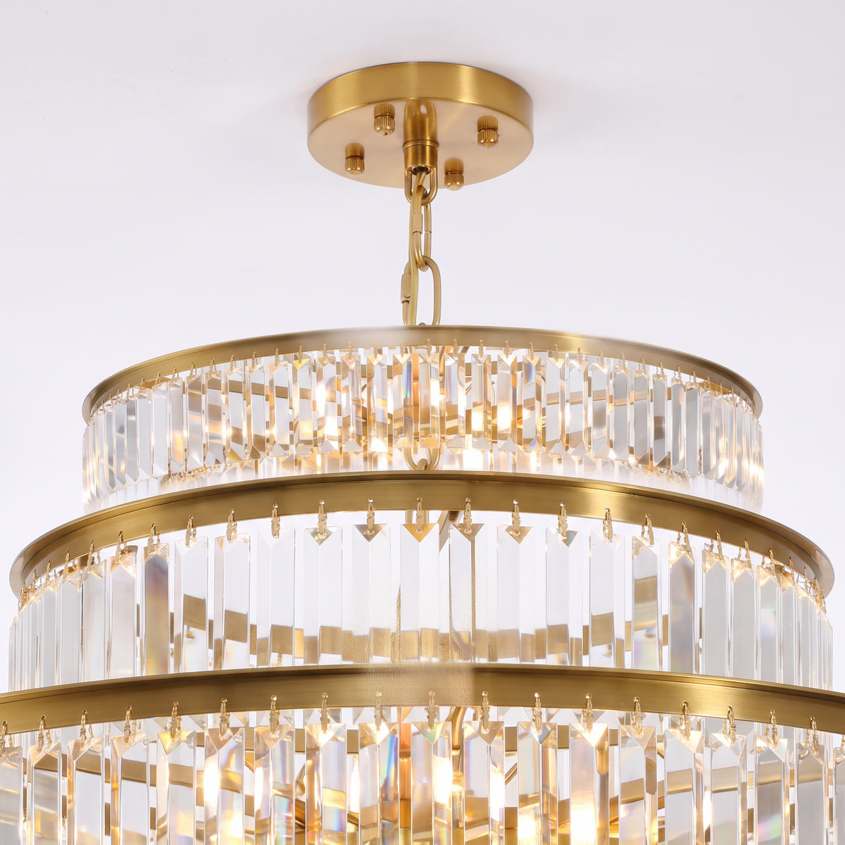 Chelsea tiered crystal chandelier, close-up of the brass gold canopy and chain