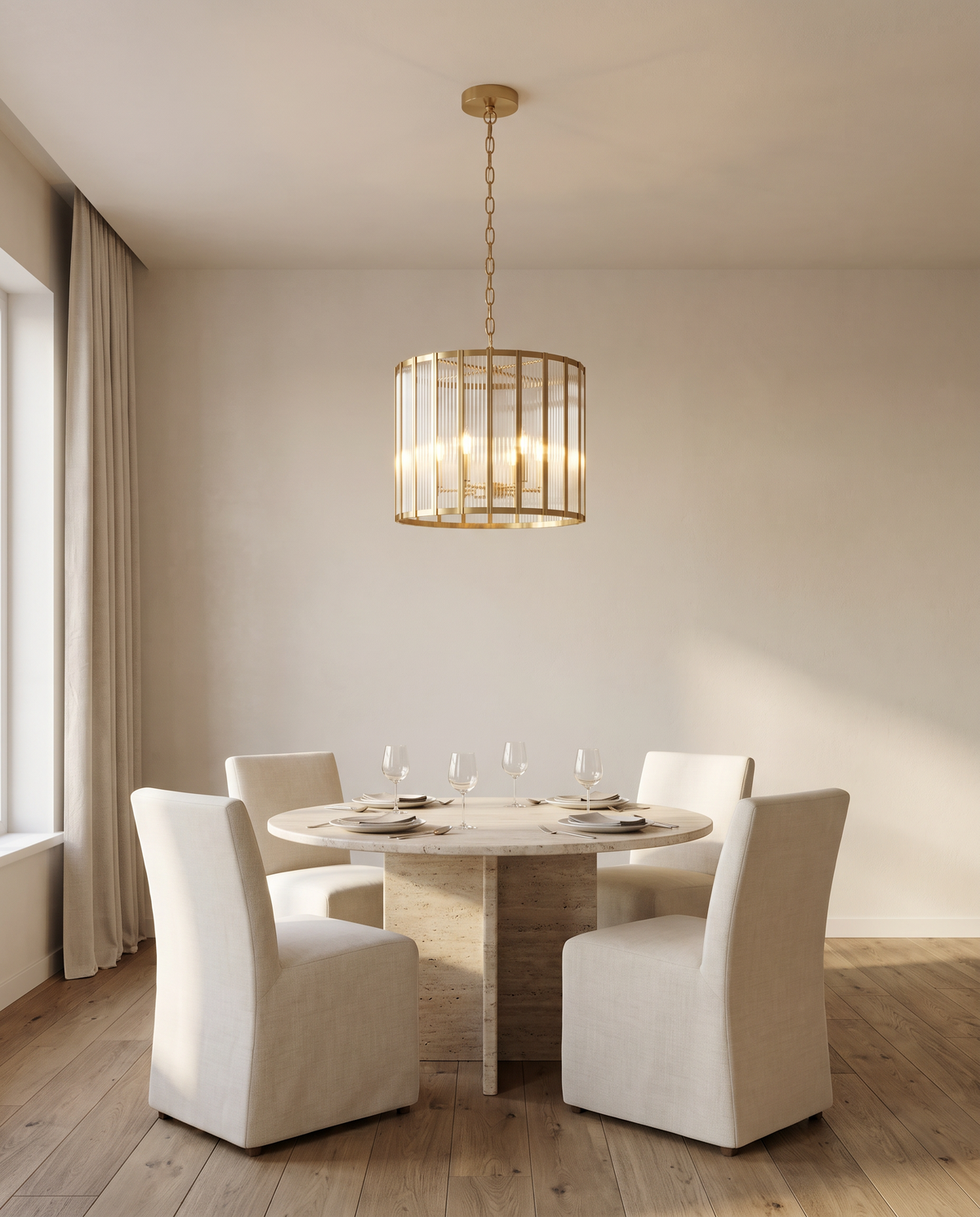 Fitzrovia fluted glass chandelier, brass drum, above a round dining table