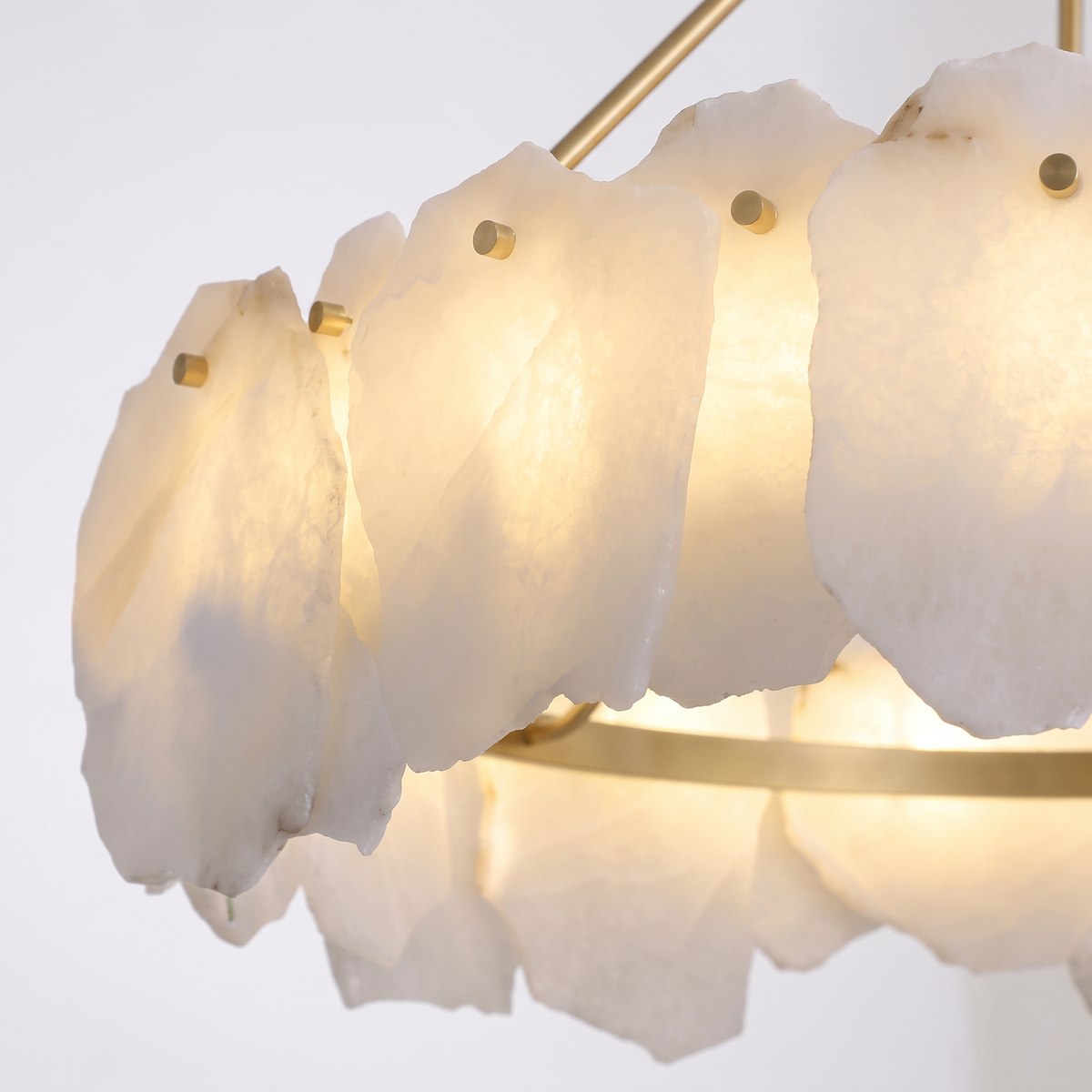 Hurlingham alabaster brass chandelier, close-up of the hand-cut alabaster slabs and brass pins