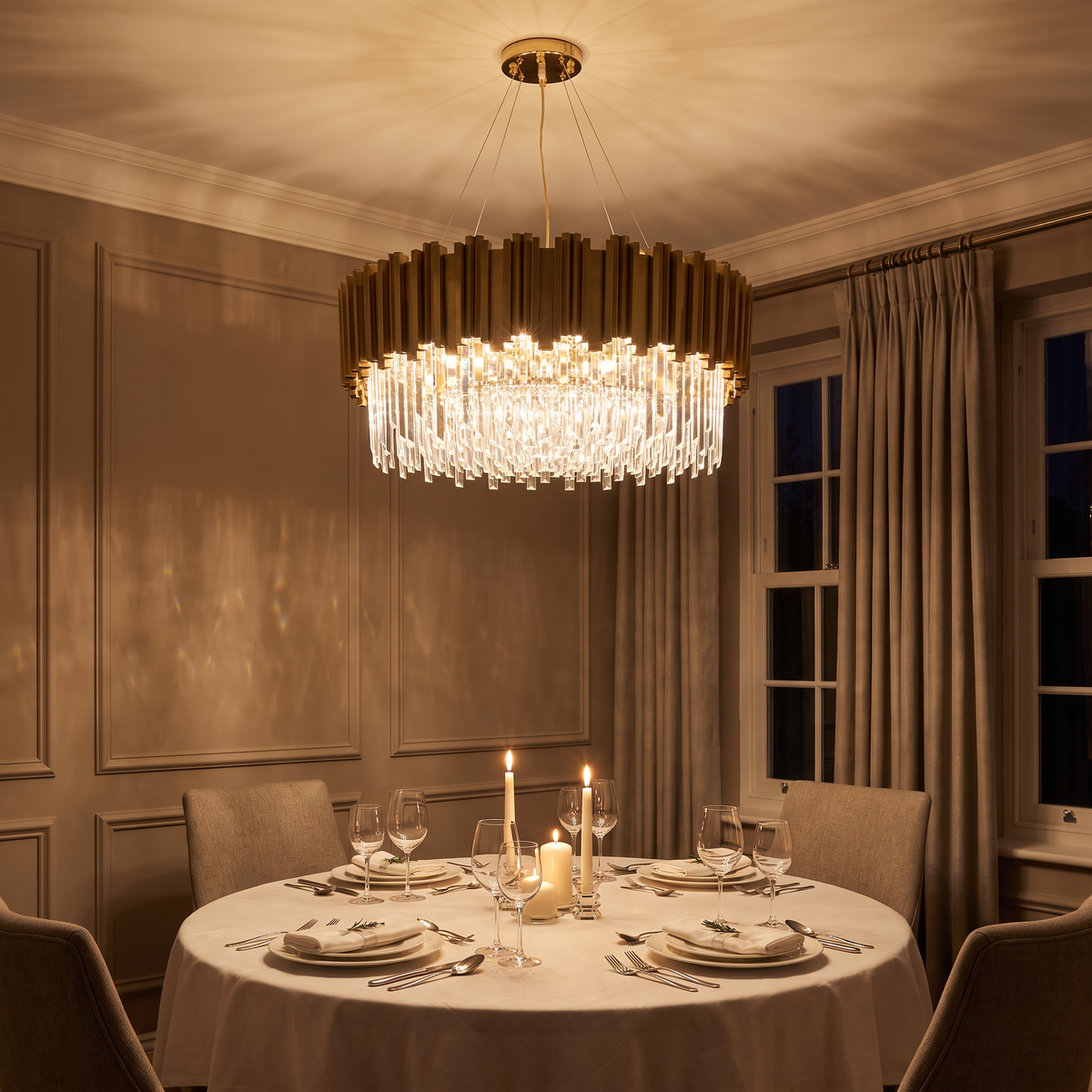Kensington round crystal chandelier lit above a round dining table in the evening