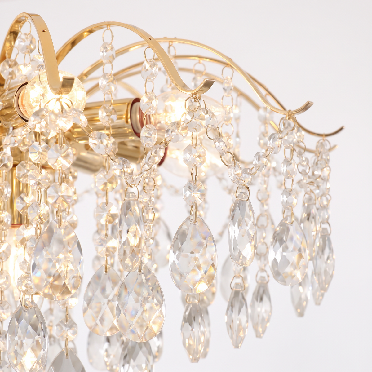 Lancaster cascade ceiling light, close-up of the crystal teardrops and curved gold arms