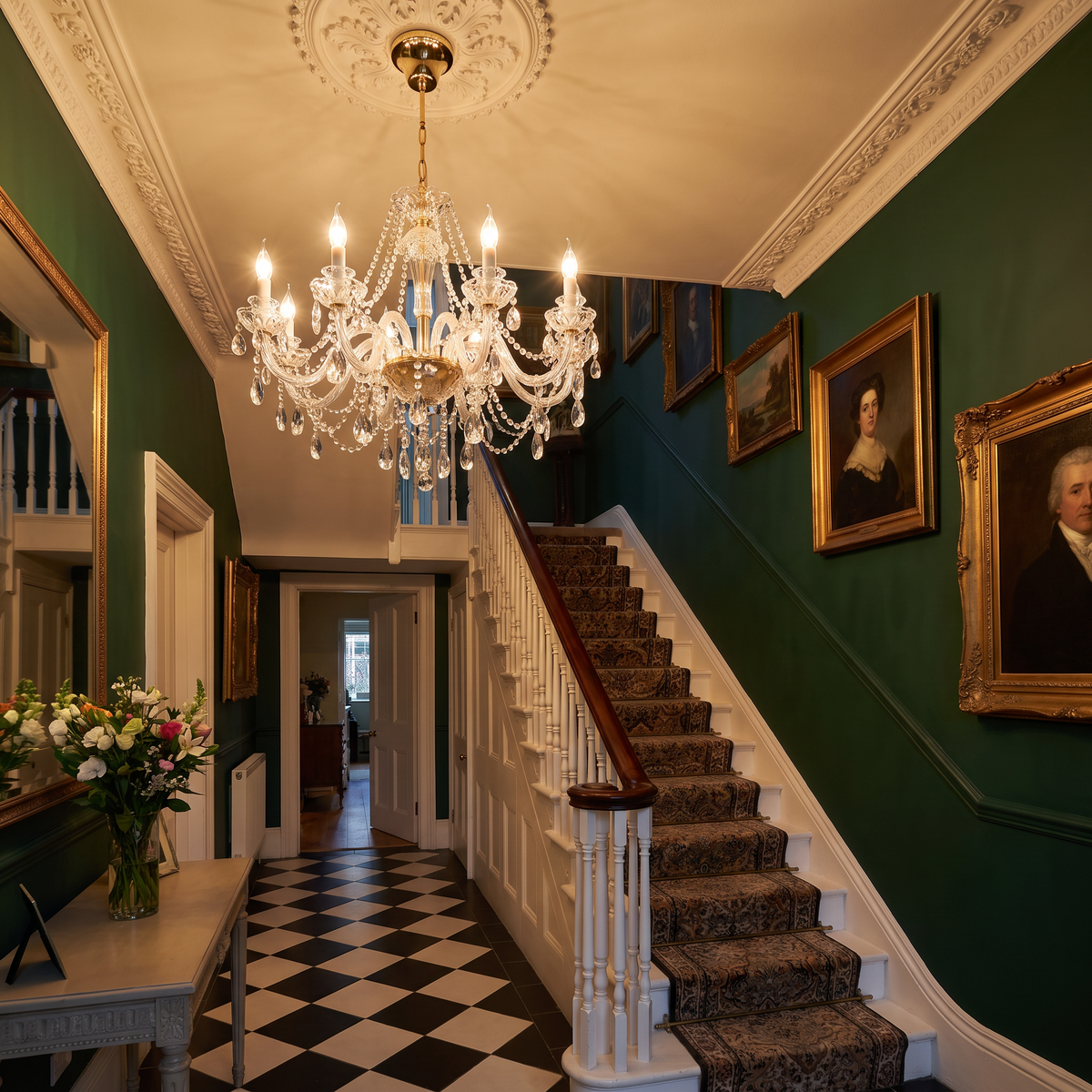 Regent crystal candle chandelier in a Victorian entrance hall with staircase
