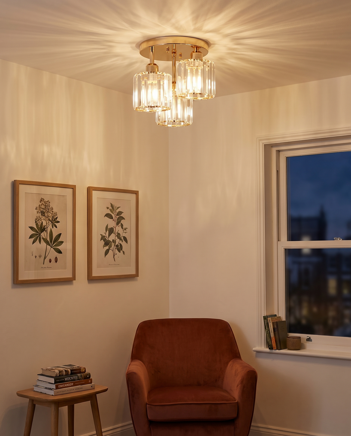 Strand crystal semi flush ceiling light lit above a reading corner
